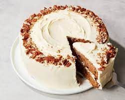 Spiced carrot cake with cream cheese frosting and a decorative crumb finish