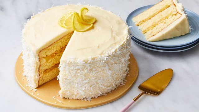 Bright lemon cake finished with shredded coconut and a citrus filling